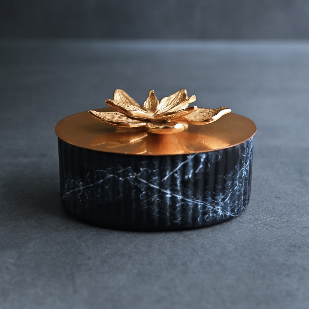black ornamental box with golden lid