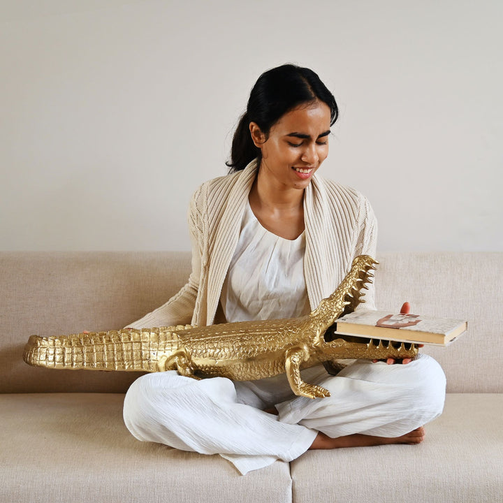Gold crocodile sculpture with intricate detailing