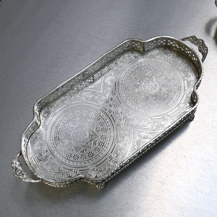 Decorative silver brass tray with intricate etching and side handles