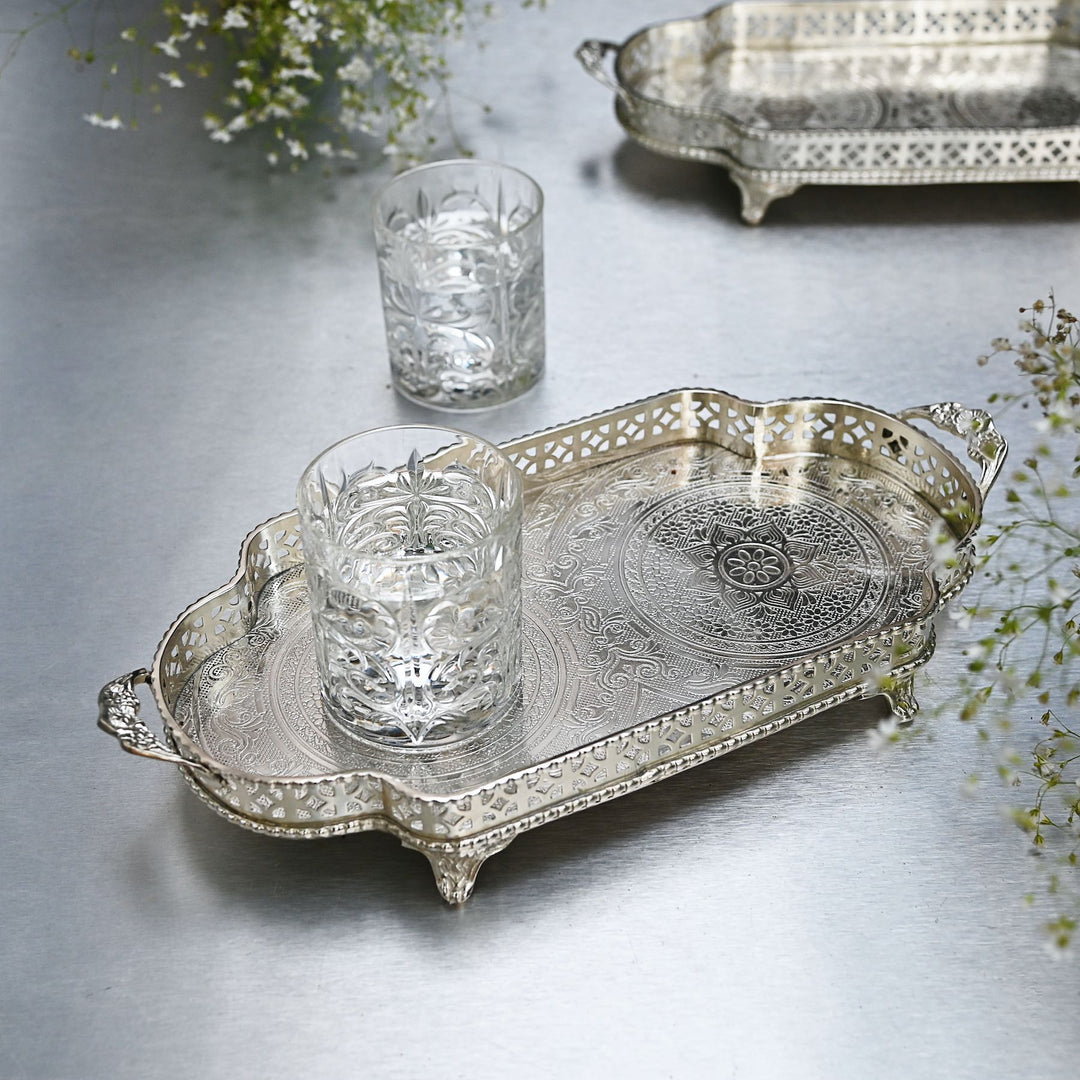 Decorative silver brass tray with intricate etching and side handles