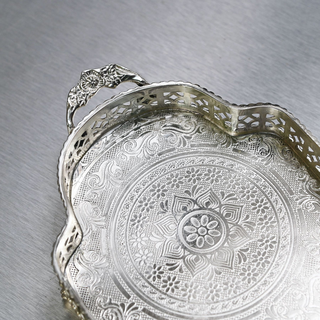 Decorative silver brass tray with intricate etching and side handles