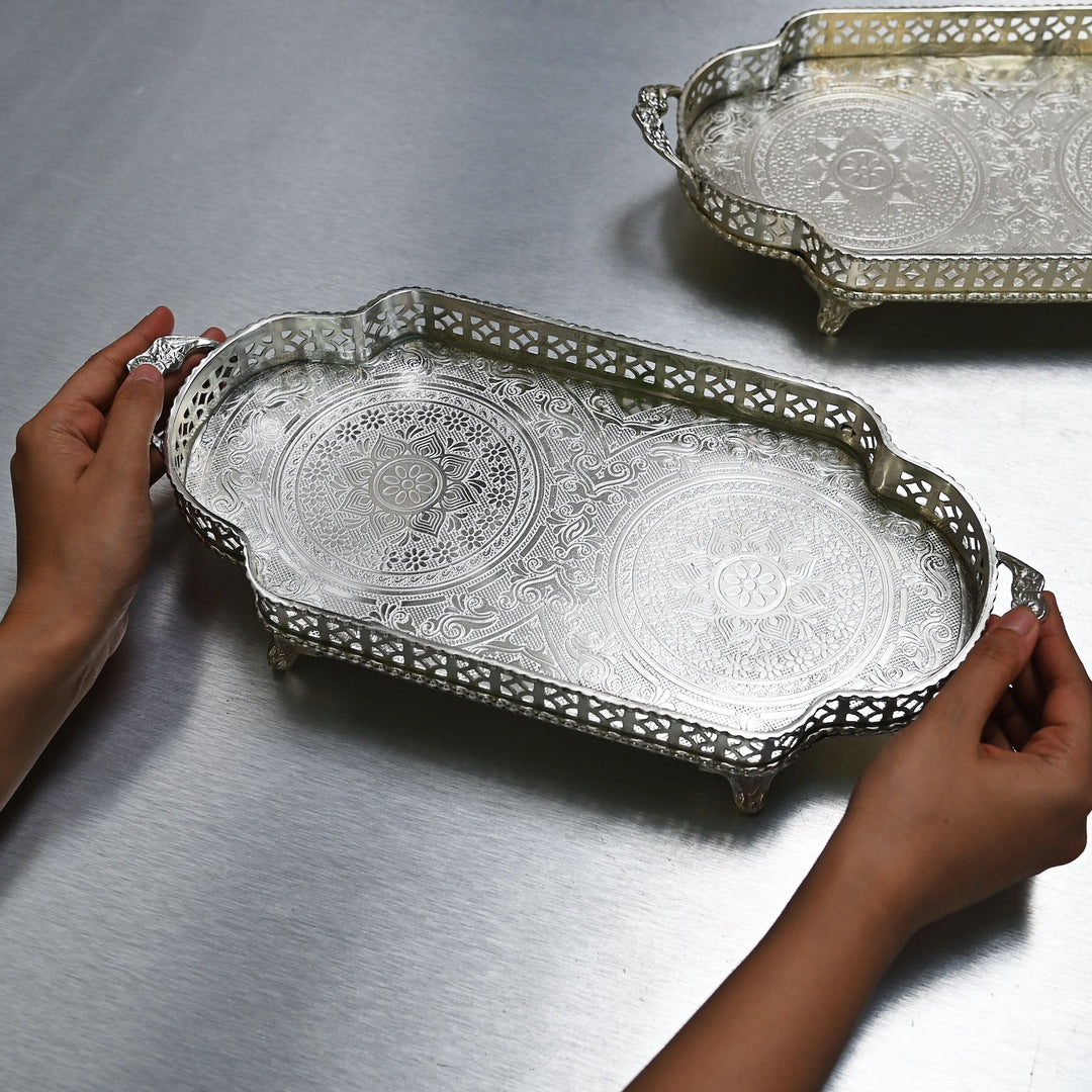 Decorative silver brass tray with intricate etching and side handles