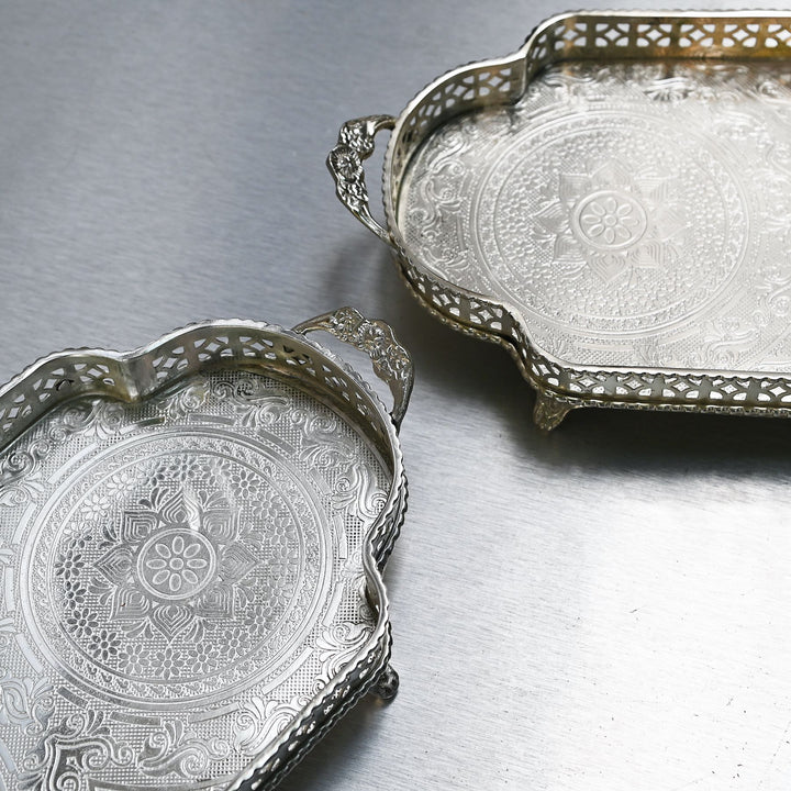 Decorative silver brass tray with intricate etching and side handles