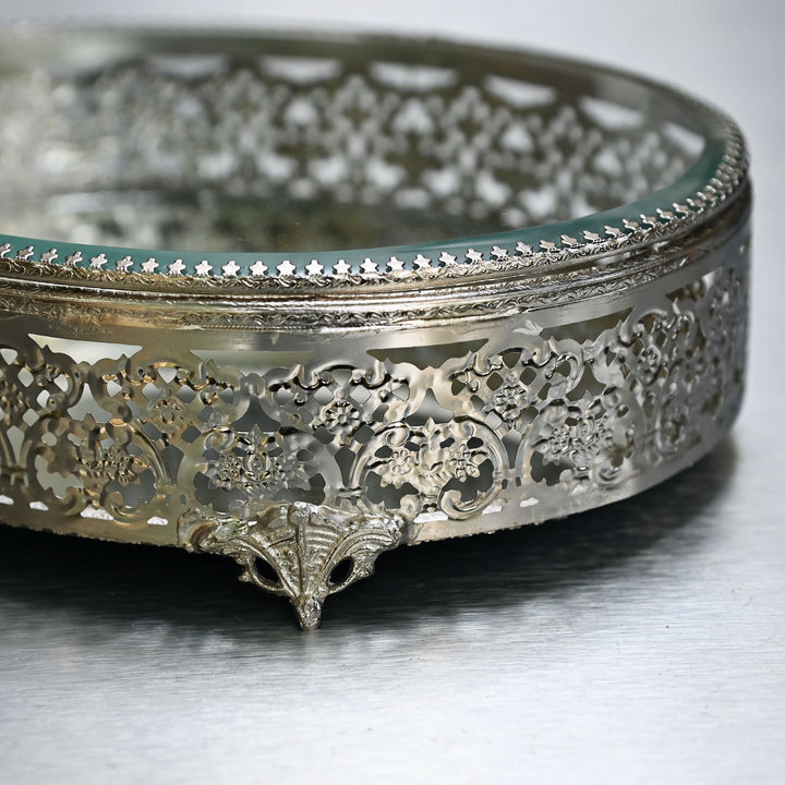 Large silver-finish glass oval box with  glass lid and intricate brass detailing