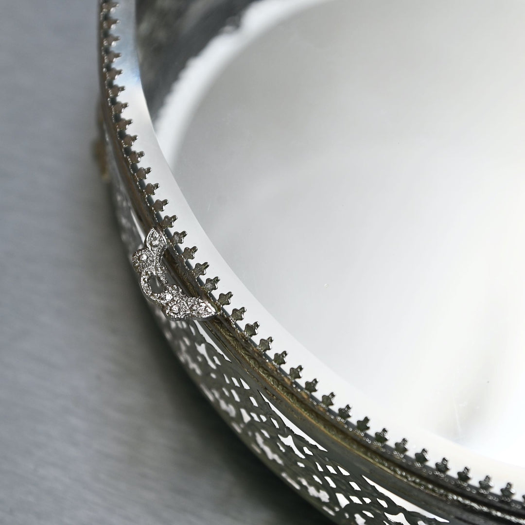 Large silver-finish glass oval box with  glass lid and intricate brass detailing