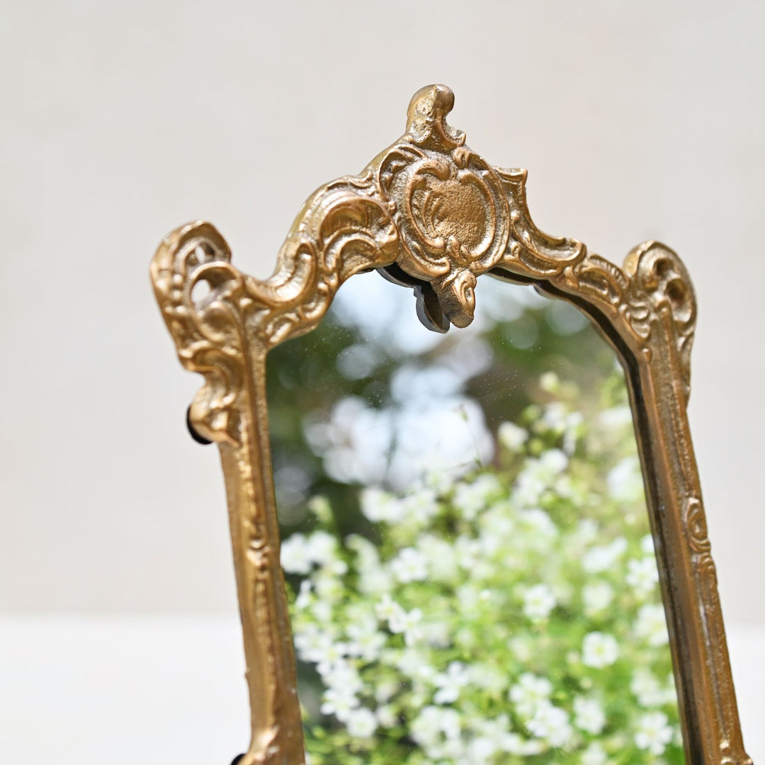 small golden tabletop vanity mirror