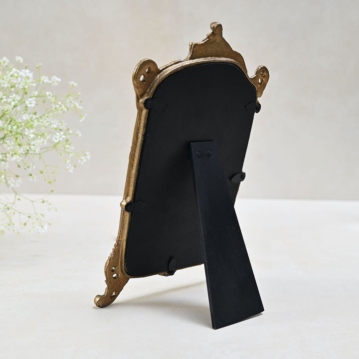 small golden tabletop vanity mirror