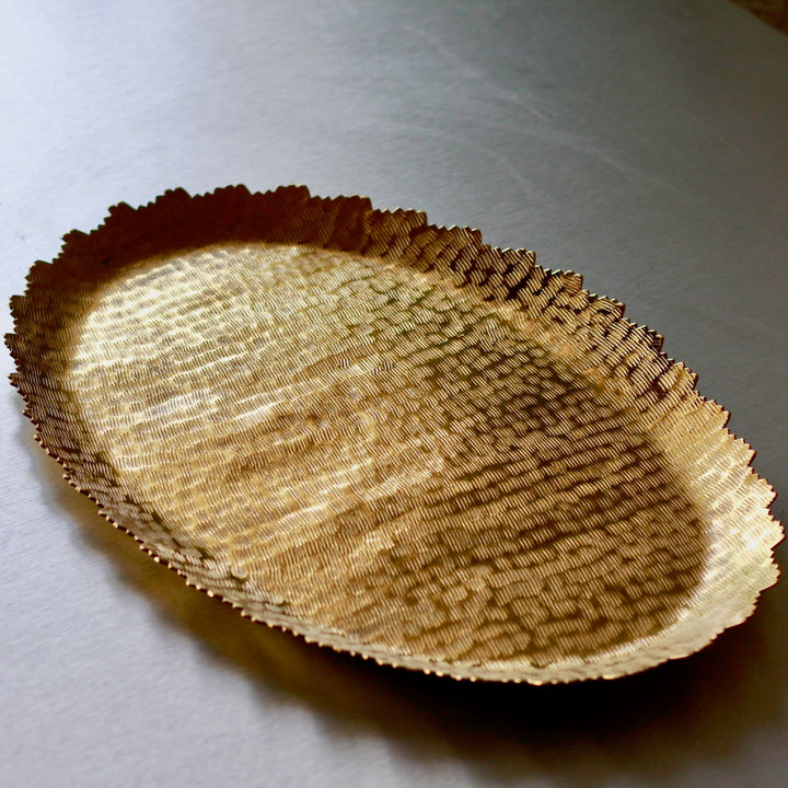gold oval metal serving tray