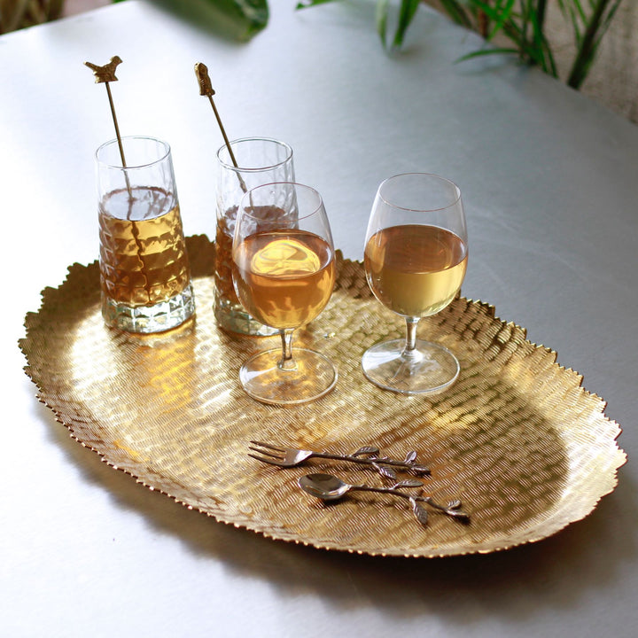 gold oval metal serving tray