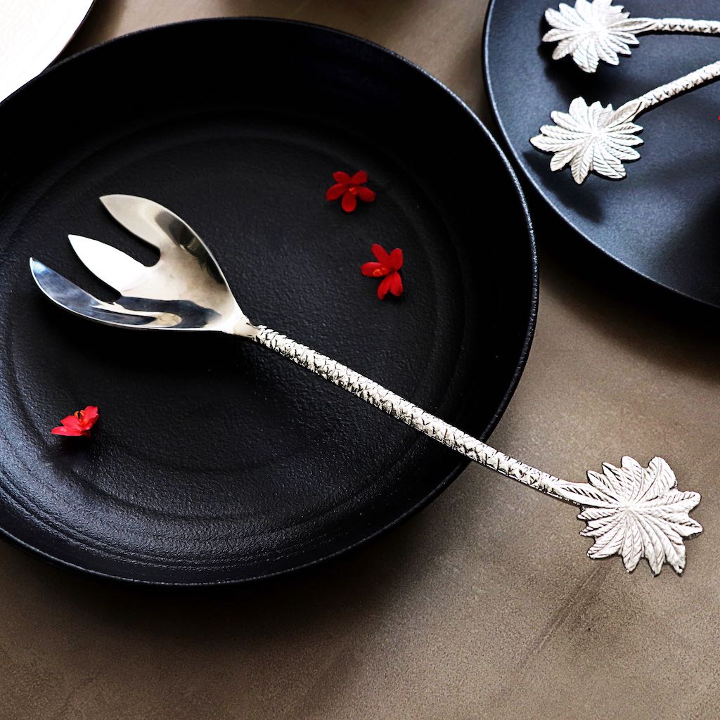 steel serving fork with palm-leaf shaped handles