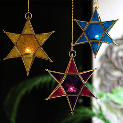 star shaped brass and glass pink t light holders