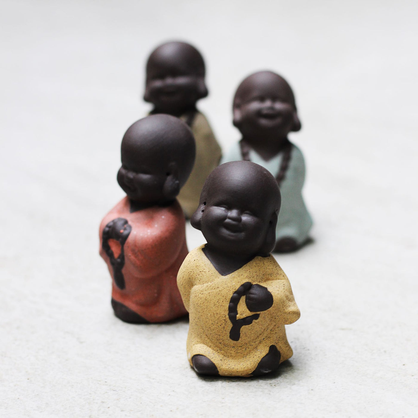 ceramic monk figurine set