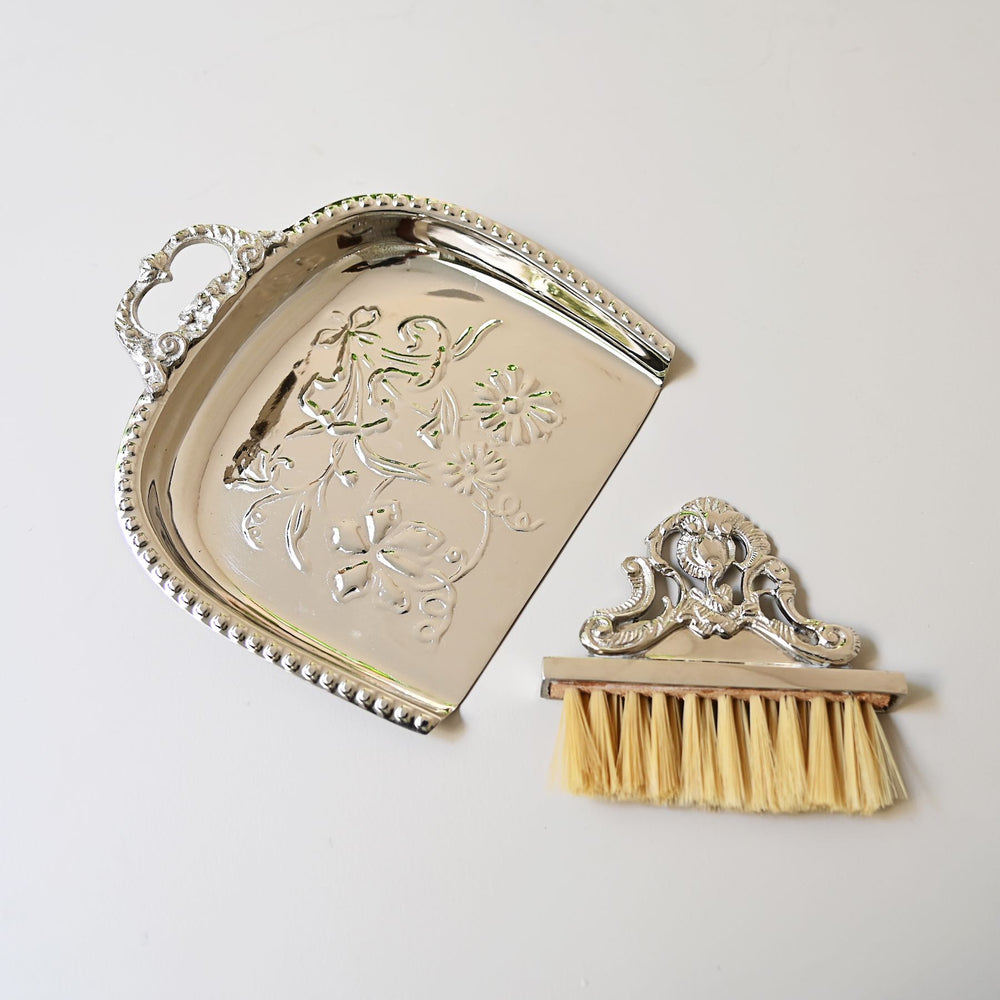 brass dust pan and brush