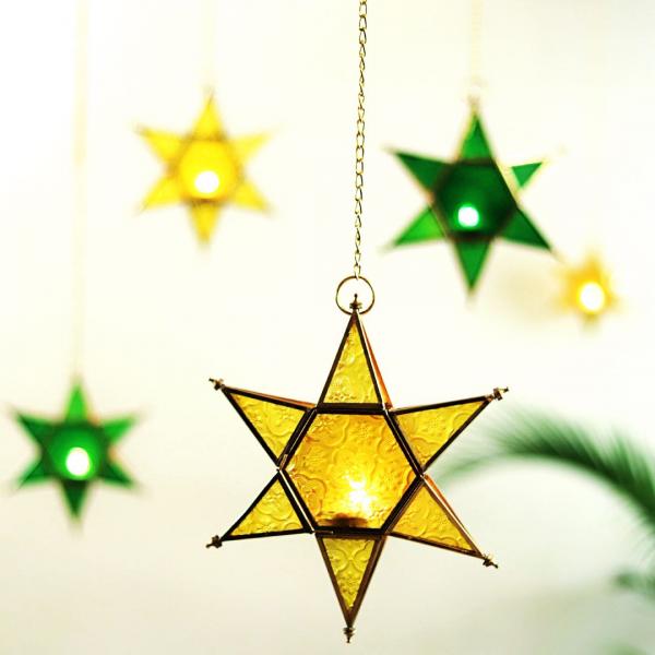 star shaped brass and glass yellow and green t light holders