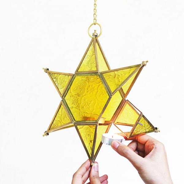 star shaped brass and glass yellow t light holder