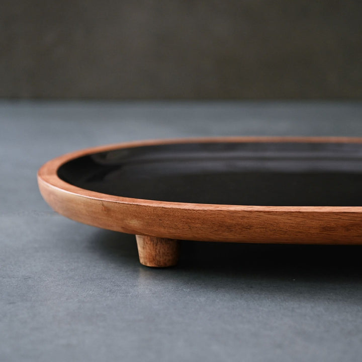 black display tray with wooden legs