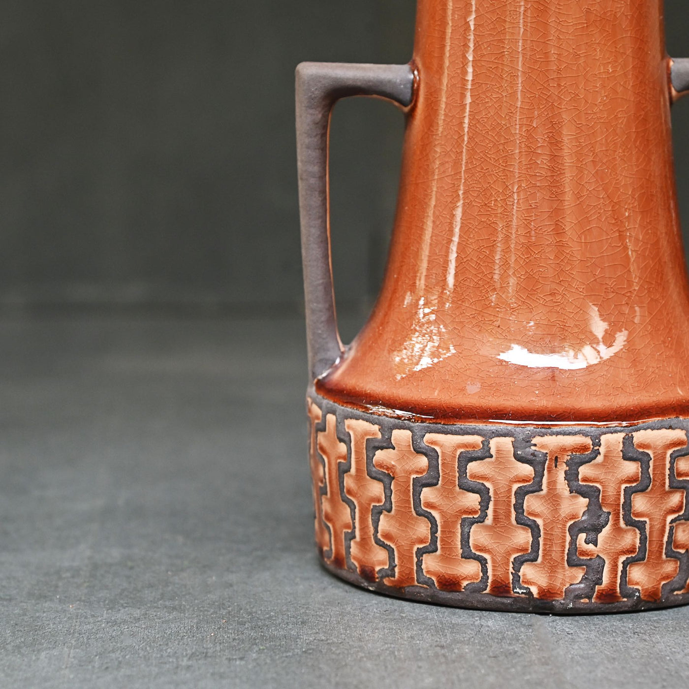 brown ceramic vase with handles