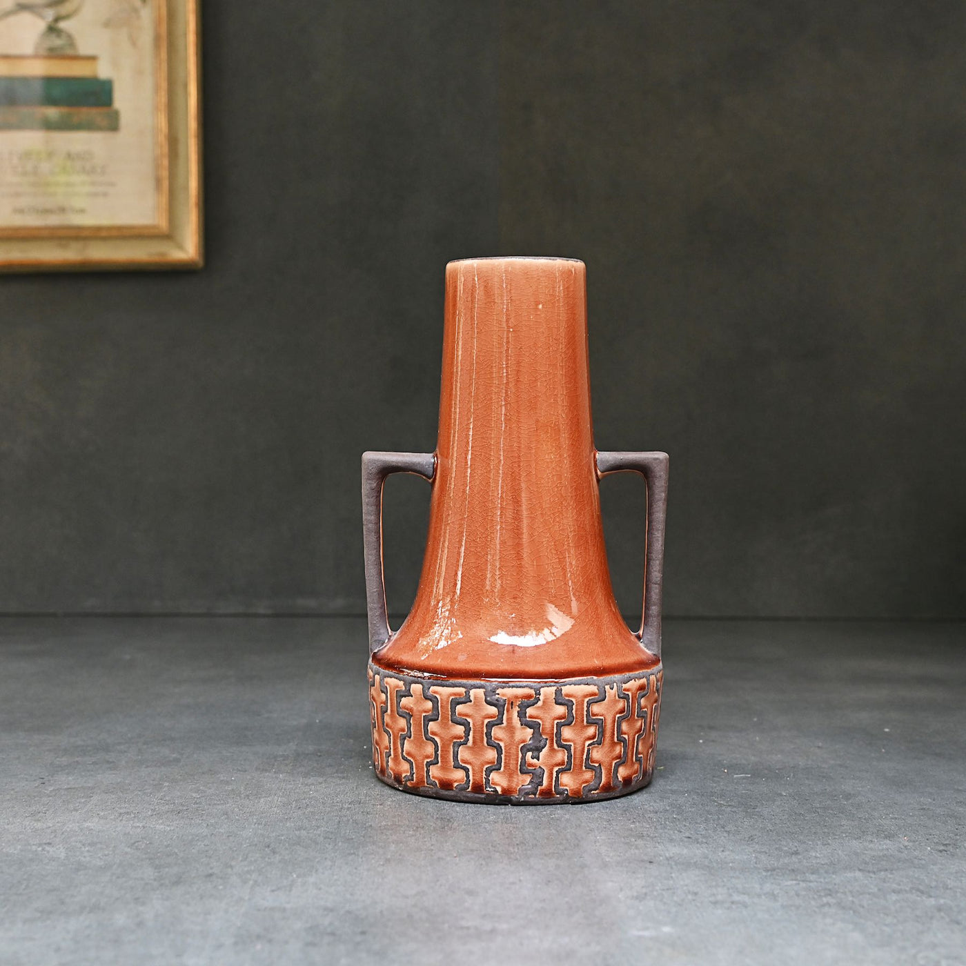 brown ceramic vase with handles