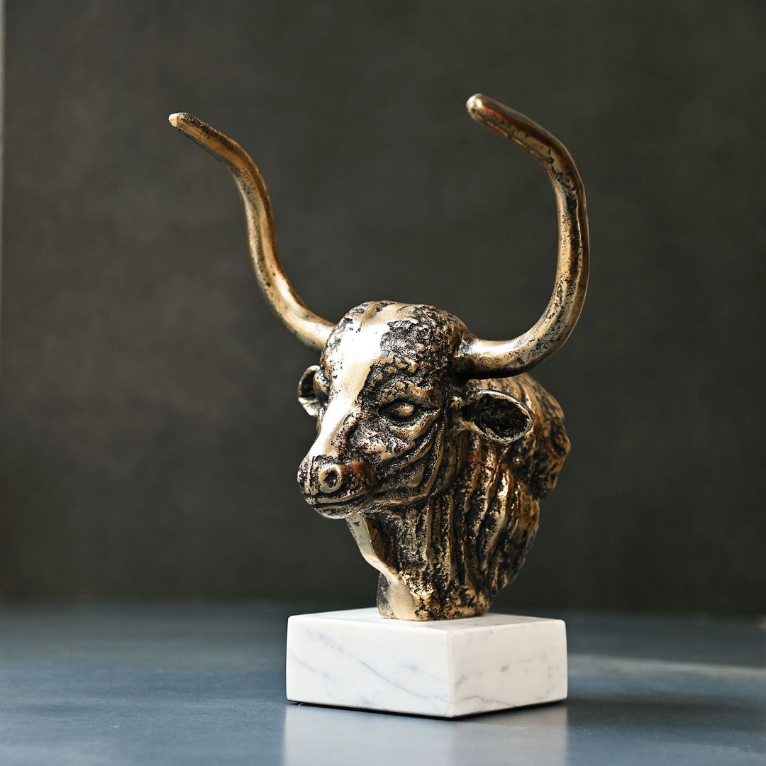 Antique brass bull head sculpture with marble base