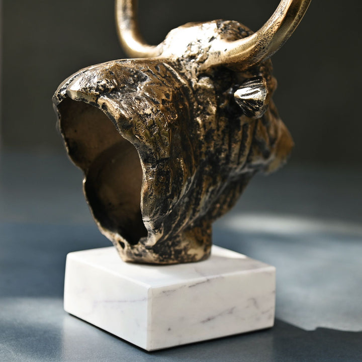 Antique brass bull head sculpture with marble base