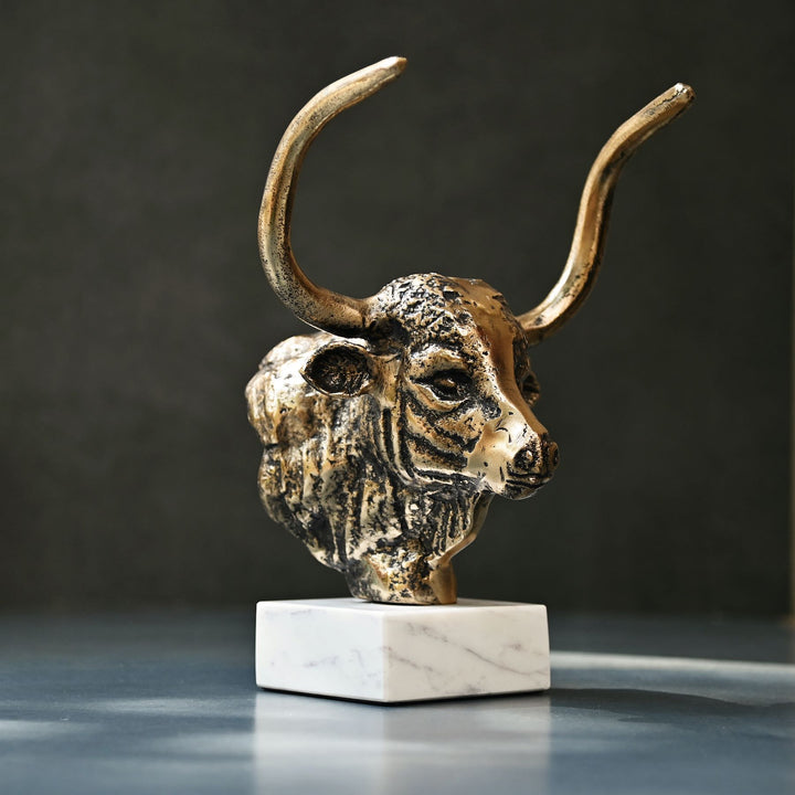 Antique brass bull head sculpture with marble base