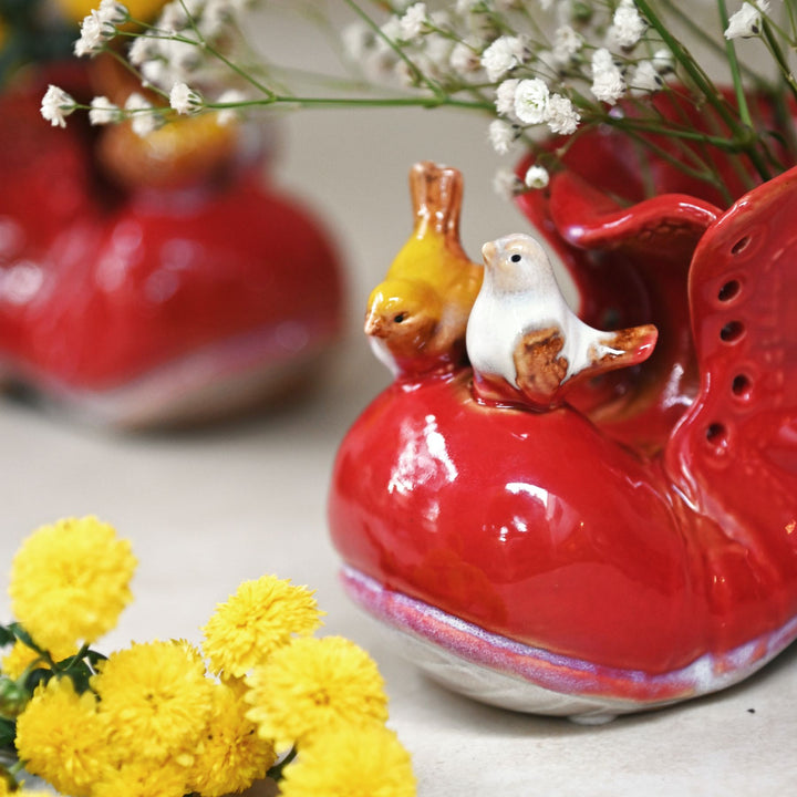 red ceramic shoe showpiece