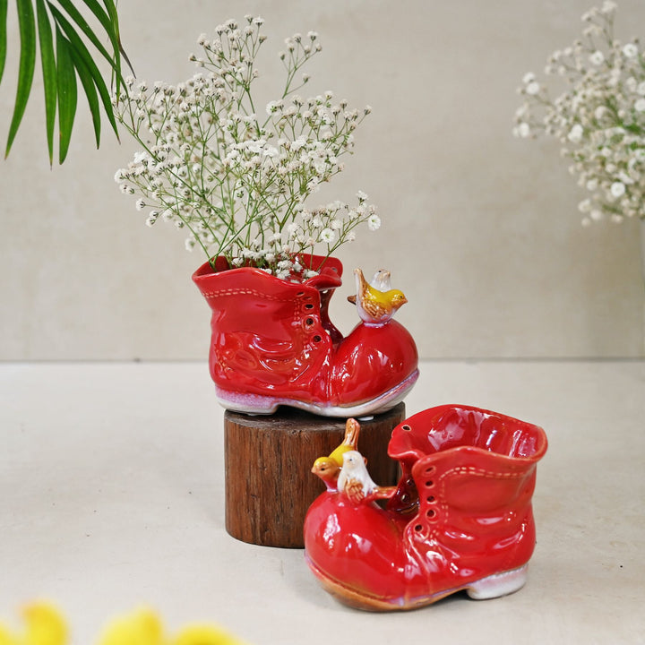 red ceramic shoe showpiece