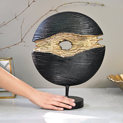 black and gold round tabletop accent