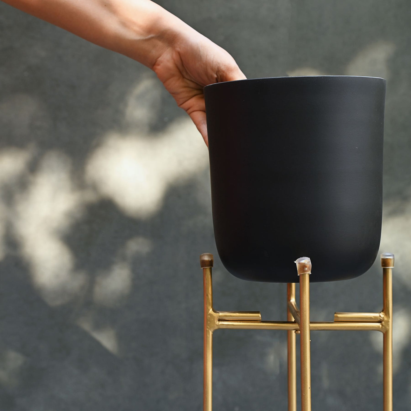 black metal planters with gold stand