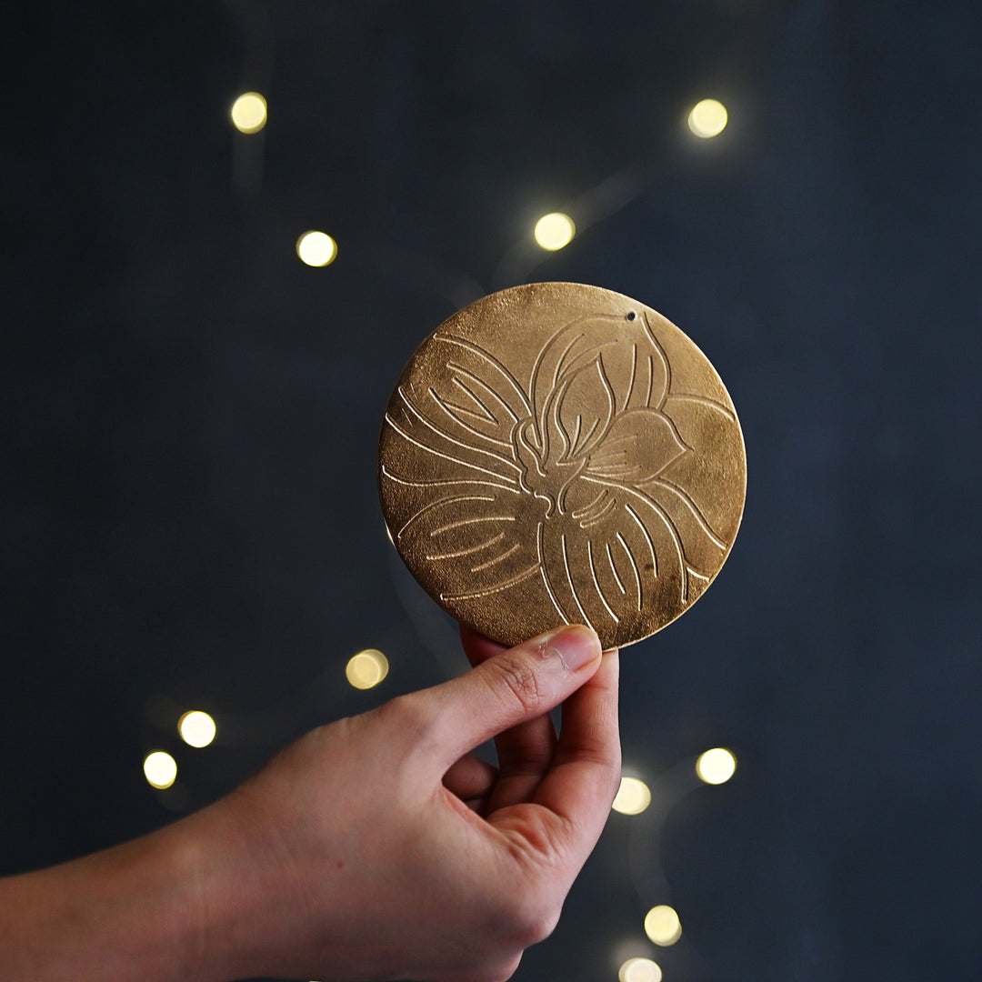 golden coaster with floral motif