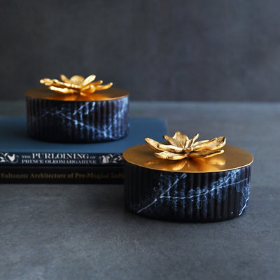 black ornamental box with golden lid