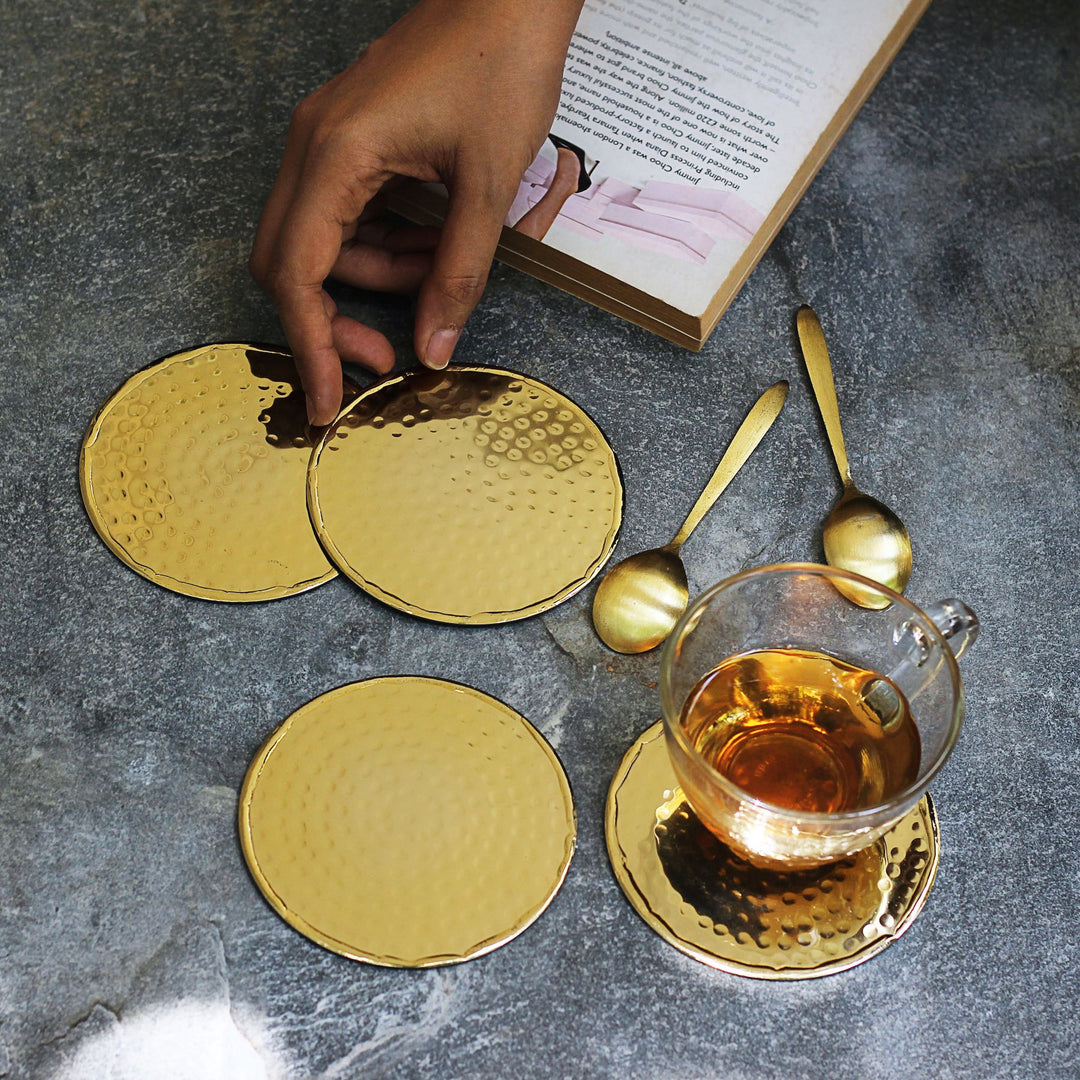 gold round metal coasters set