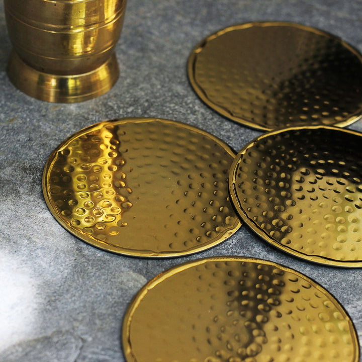 gold round metal coasters set