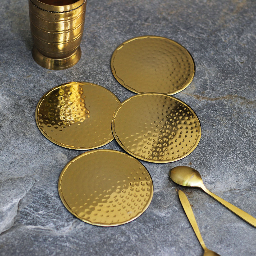 gold round metal coasters set