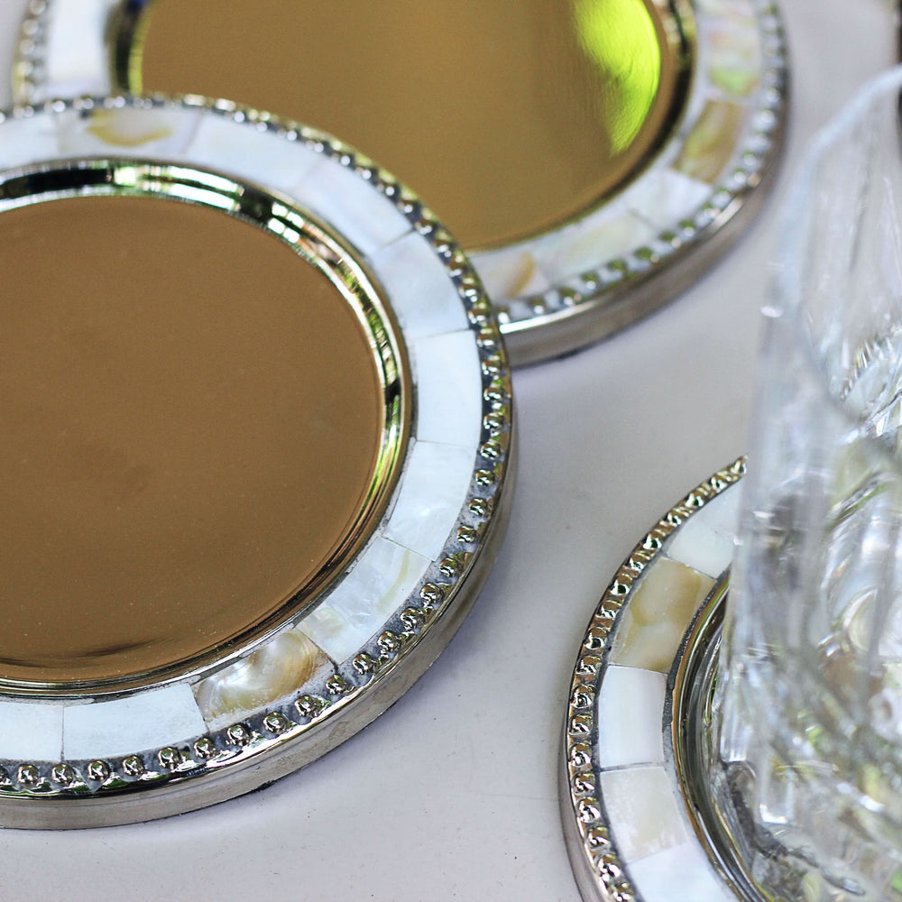 round brass and mother of pearl coasters set