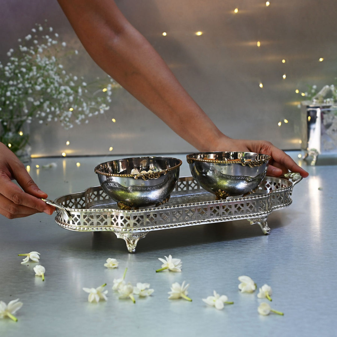 Silver bowls on a decorative tray