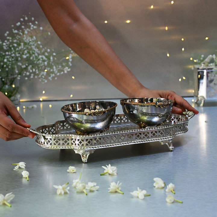Silver bowls on a decorative tray
