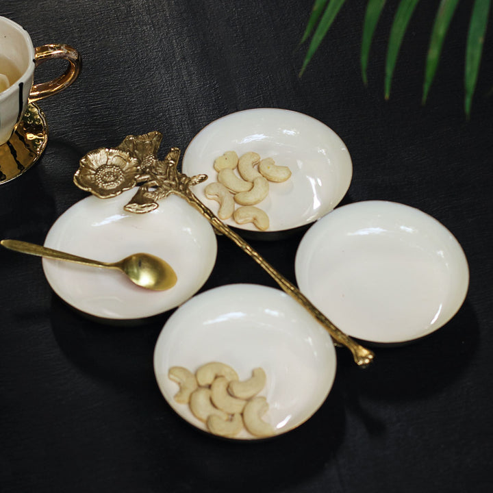 white & gold serving platter with four bowls