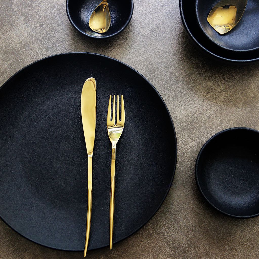 gold-coloured dining cutlery set
