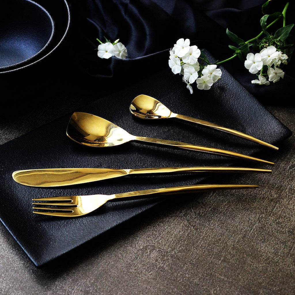 gold-coloured dining cutlery set