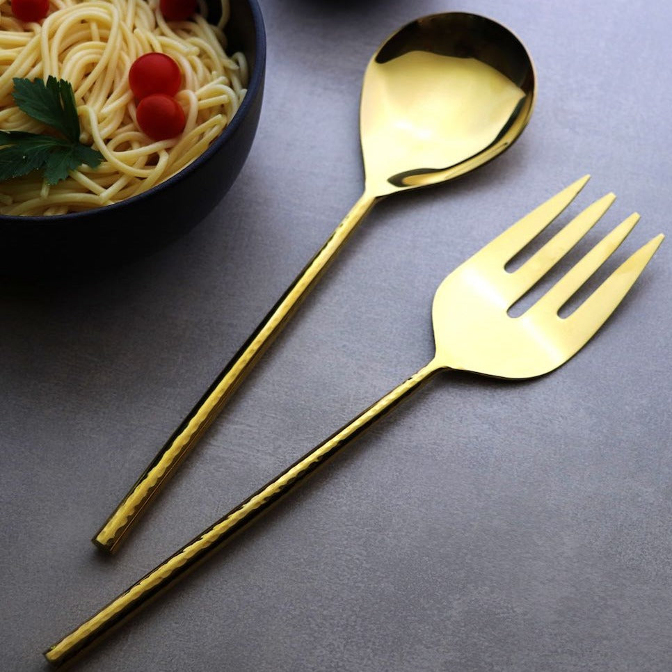 gold-coloured serving cutlery set