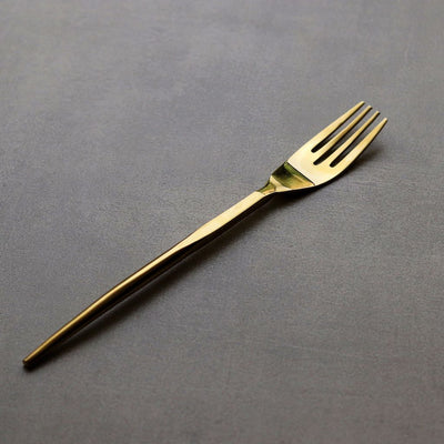 gold-coloured dining fork