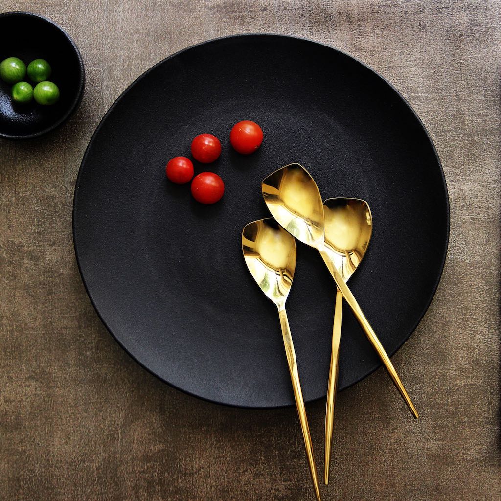 gold-coloured dining spoons