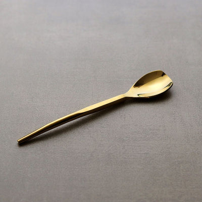 gold-coloured dining spoon