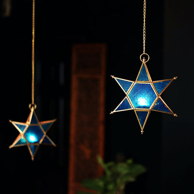 star shaped brass and glass t light holders