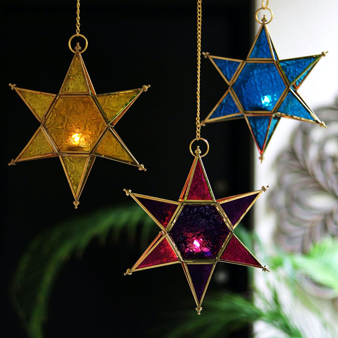star shaped brass and glass blue t light holders