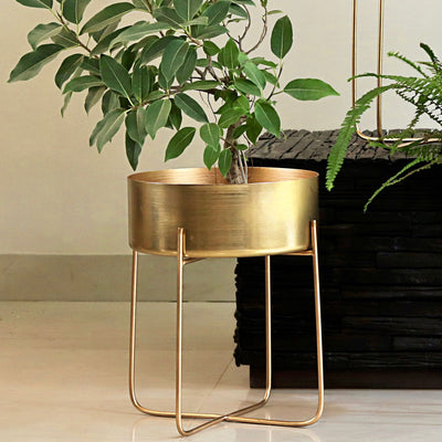 golden brass planter with legs