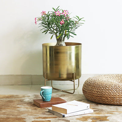 golden brass metal planter with legs