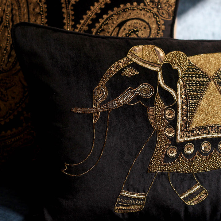 black velvet sofa cushion with golden embroidered elephant design