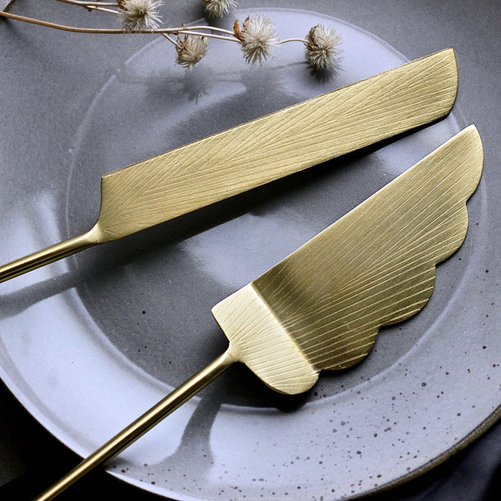 gold cake server and knife